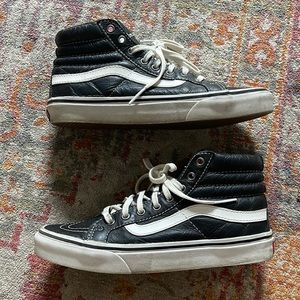 Vans black leather high tops woman’s size 7/mens size 5.5